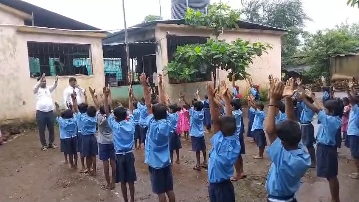 Children participating in an outdoor learning activity with Rudra Foundation volunteers