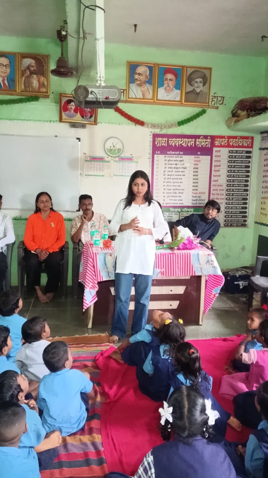 A volunteer speaking with children during a learning and mentorship session